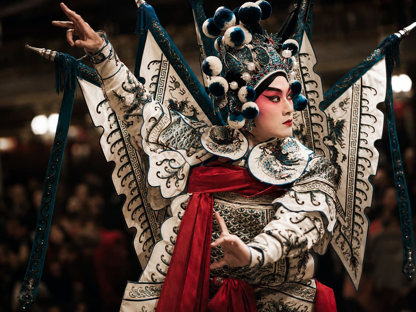 A Peking opera performance, a warrior character in painted face and Qing-dynasty armour on stage