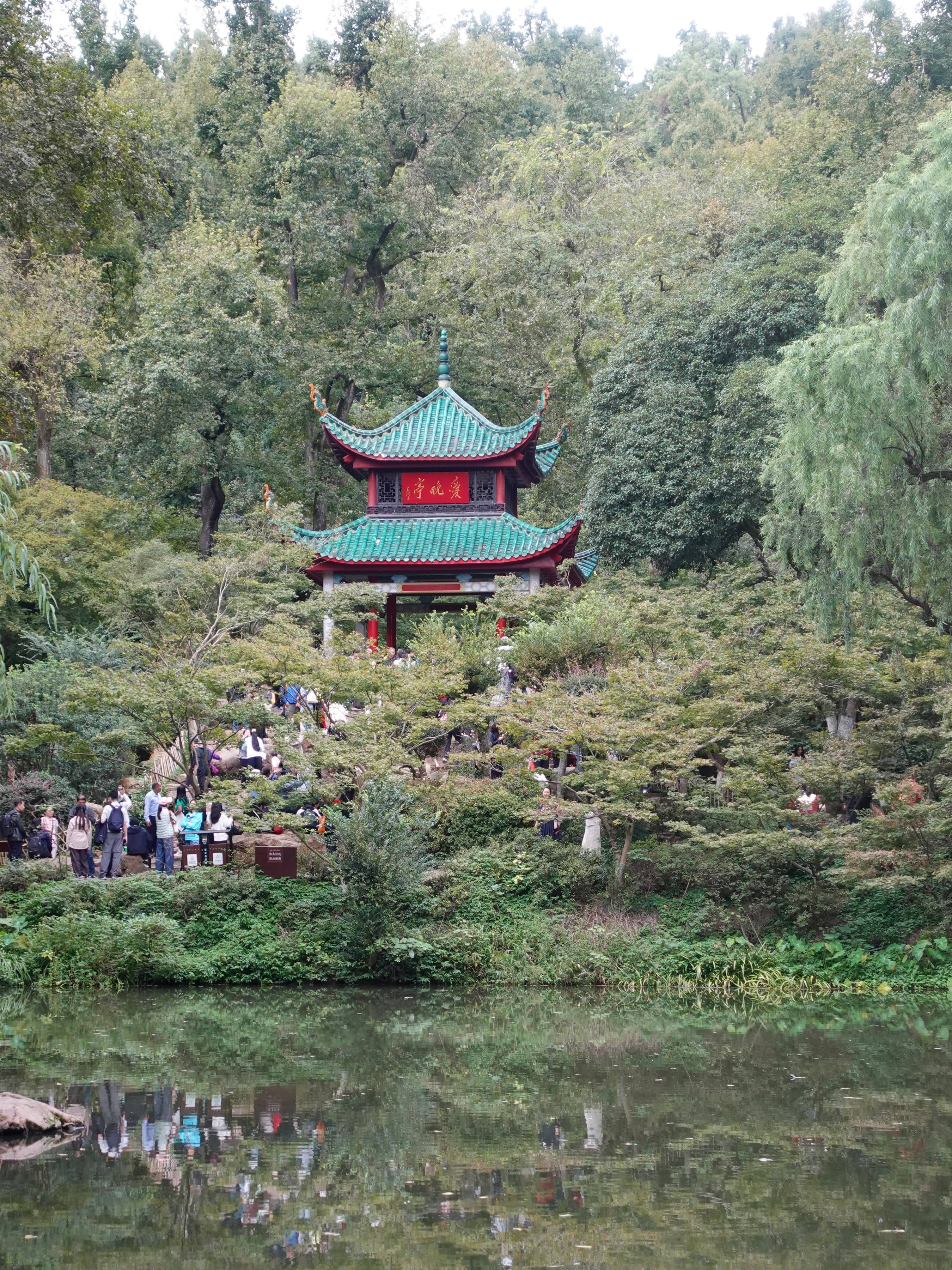 Maple leaves in deep red and orange around Aiwan Pavilion on Yuelu Mountain, the Xiang River below, Changsha