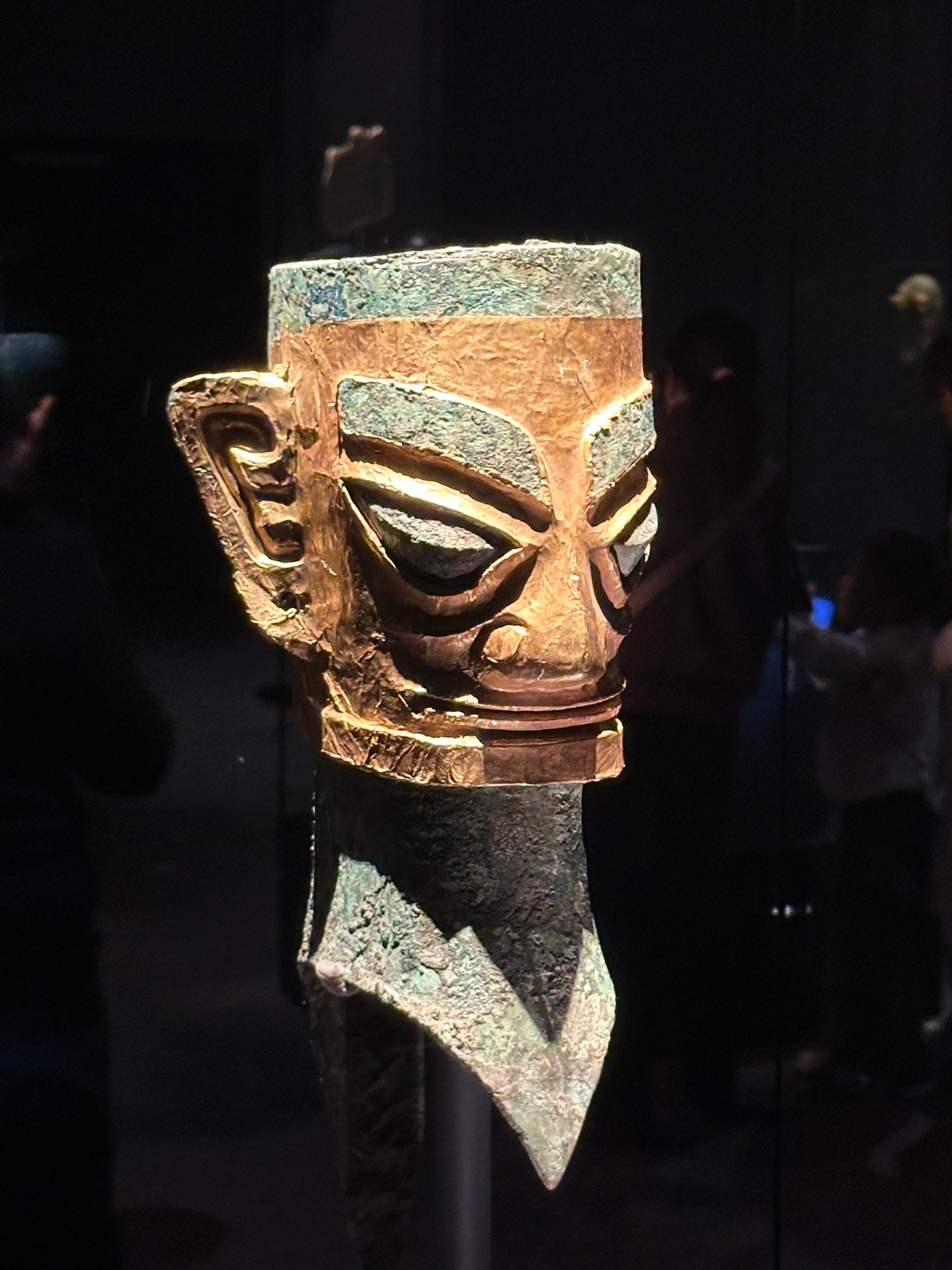 The 2.6-metre bronze standing figure from the Sanxingdui Bronze Age site, the largest bronze human of the ancient world, with arms outstretched holding a ceremonial object