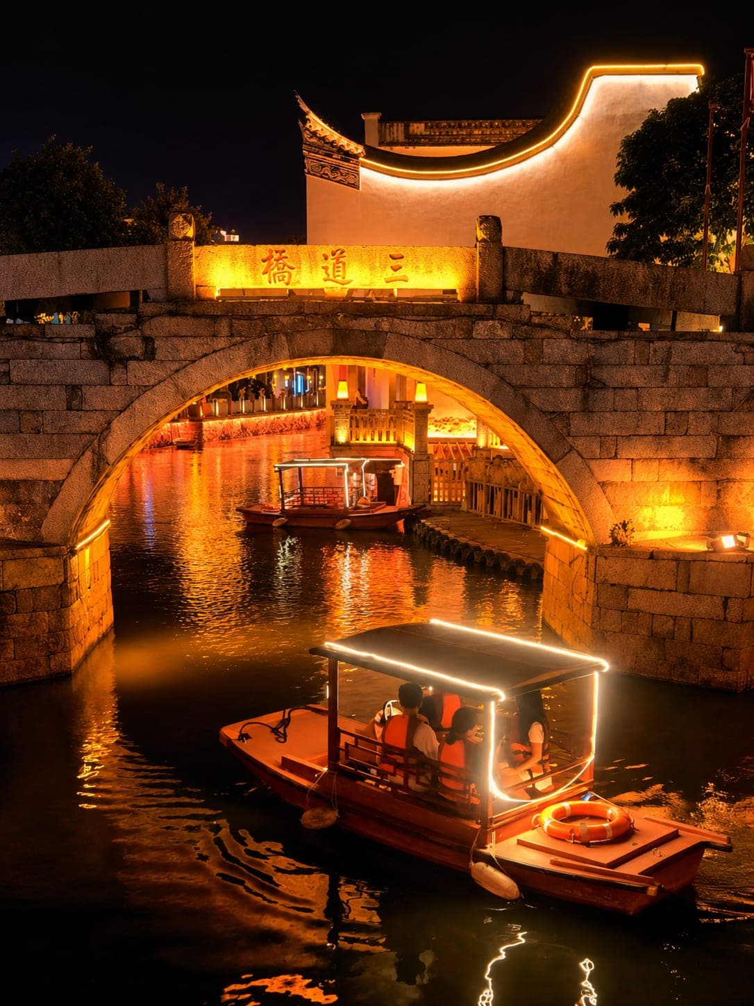 Santong Bridge lit at night over the canal at Shangxiahang, the merchant-guild quarter of Fuzhou