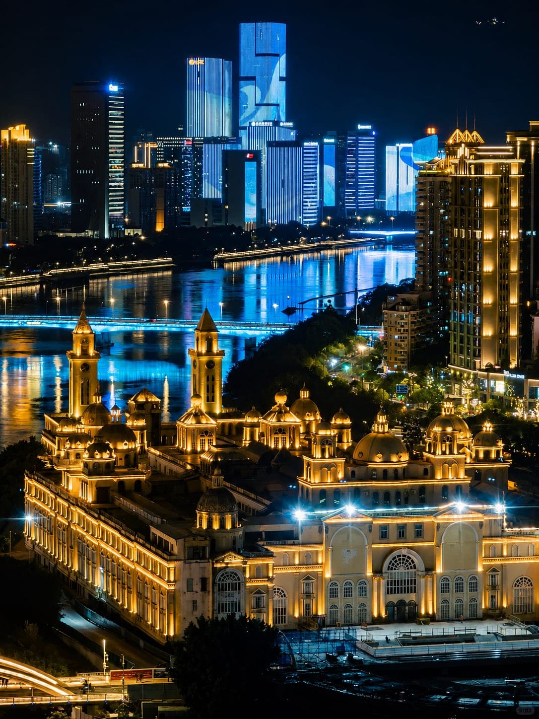 Zhongzhou Island's European-style block lit at night, with the Min River bridge and the Fuzhou skyline behind