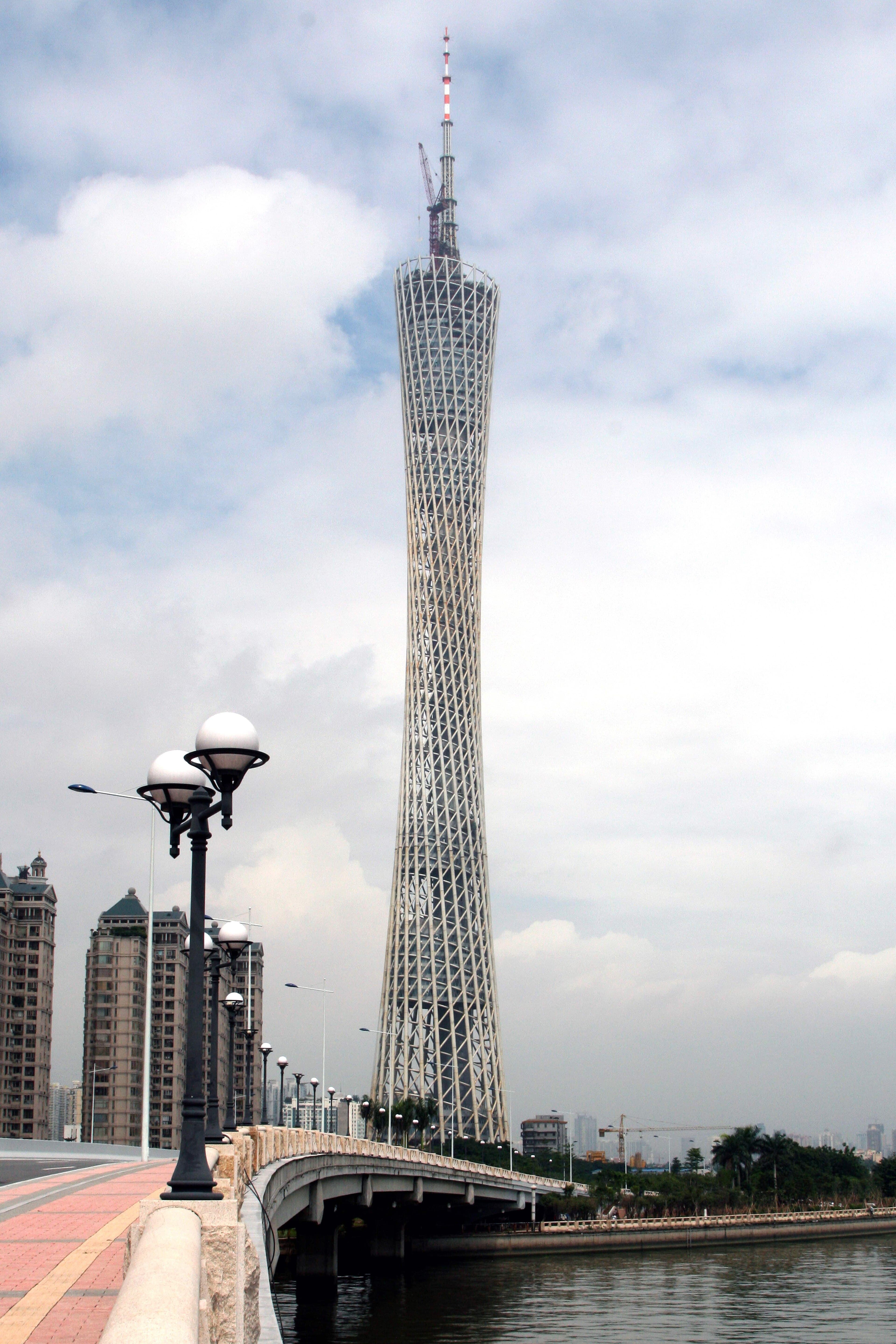 Canton Tower at blue hour, the hyperboloid steel lattice lit against the Pearl River, Guangzhou