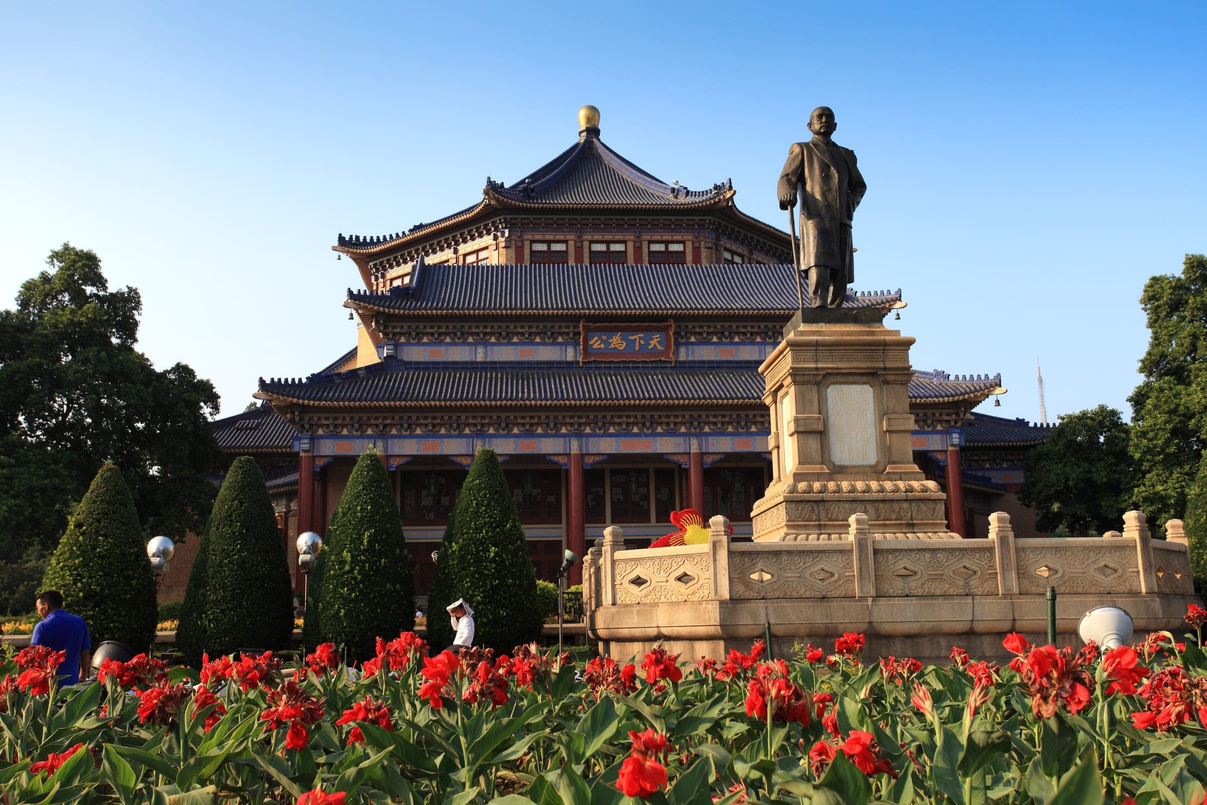 The bronze statue of Sun Yat-sen in front of the blue-tiled octagonal Memorial Hall, Guangzhou