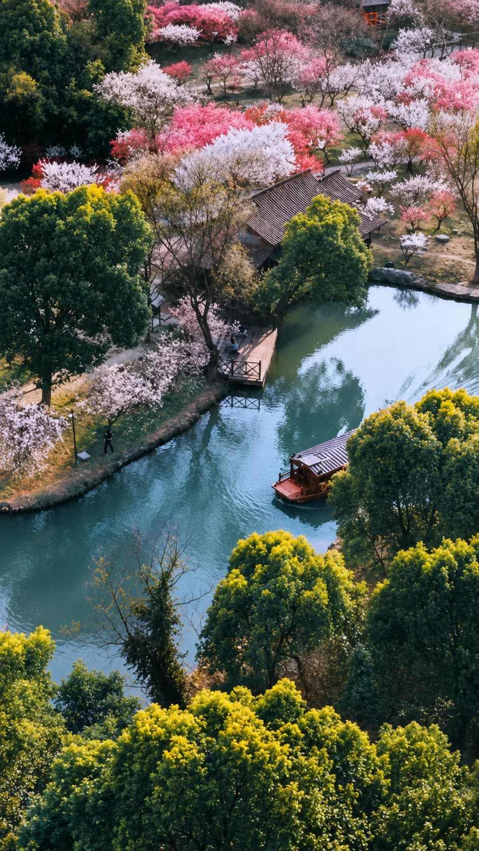 A covered wooden passenger boat tied at the dock at Xixi National Wetland Park in Hangzhou, ready to take a small group through the inner waterways