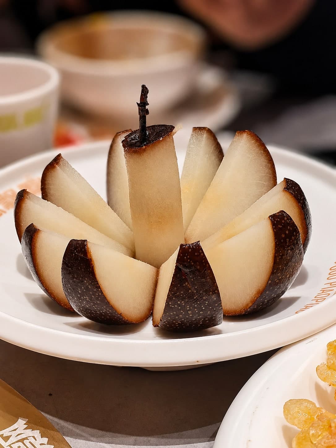 Frozen pears, the Northeast winter snack, their coal-black skin formed by storing autumn pears outdoors until they freeze solid