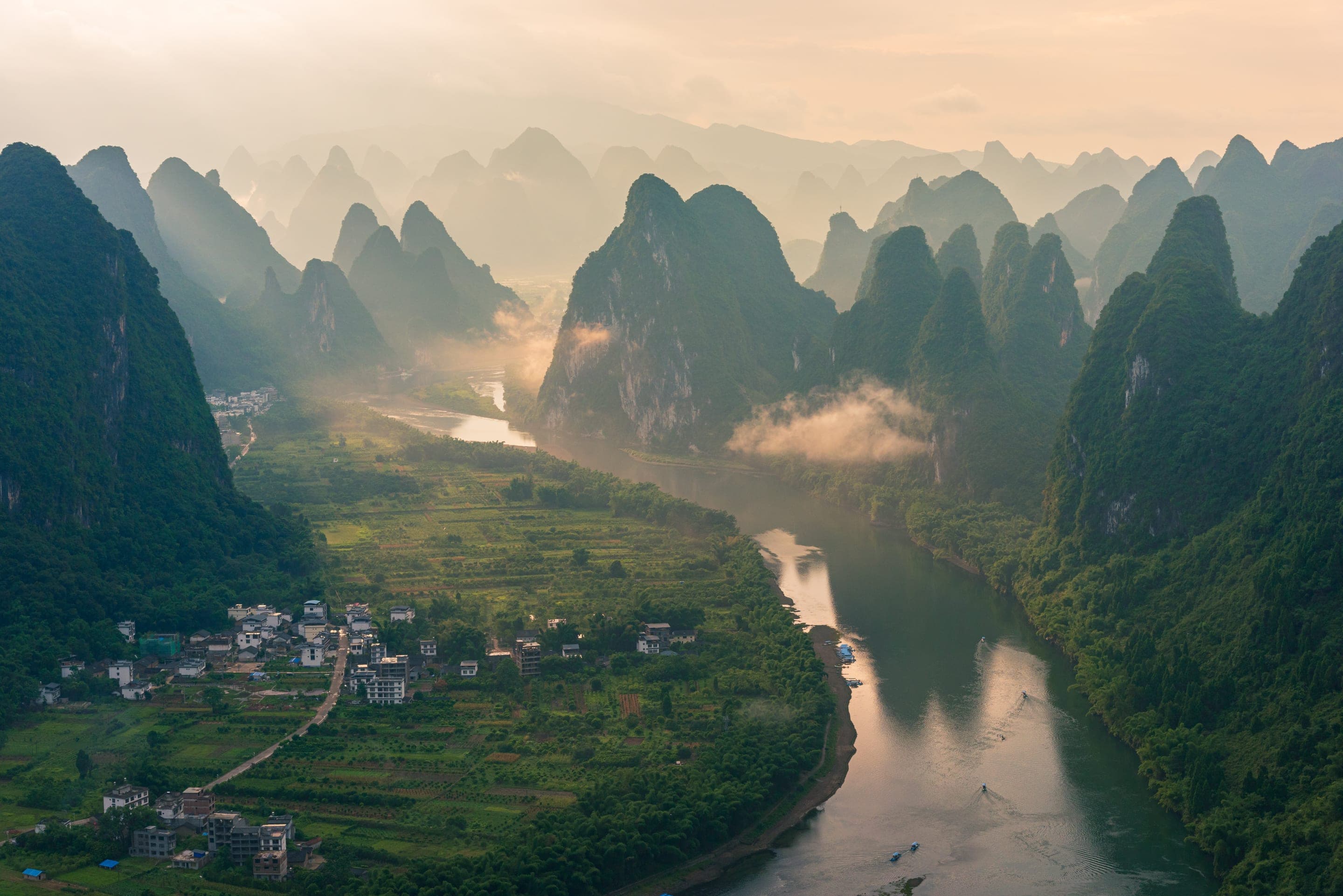 Mist over the terraced hills of southern China at first light