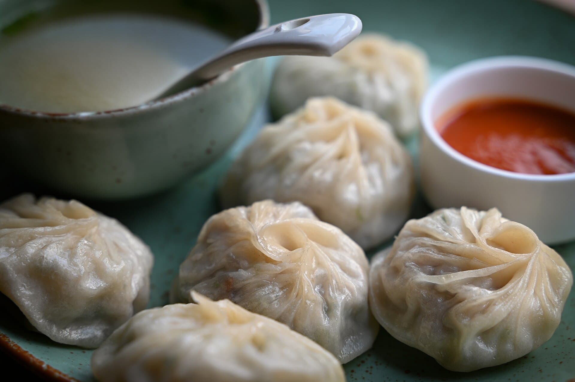 Steamed Tibetan momos on a plate, the canonical lunch spread