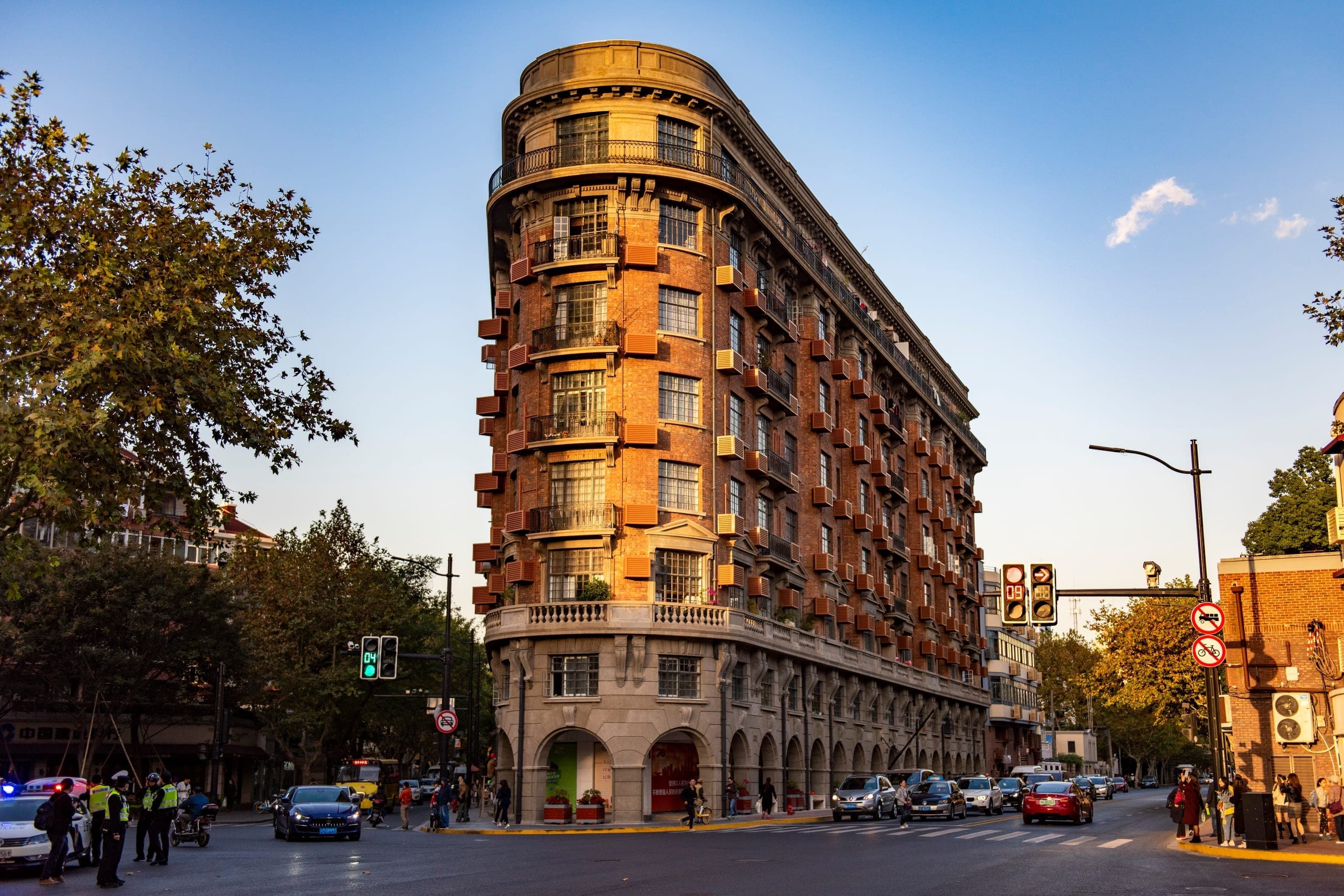 The 1924 Wukang Mansion at the Wukang and Huaihai corner, the French Renaissance Revival wedge building seen from across the junction