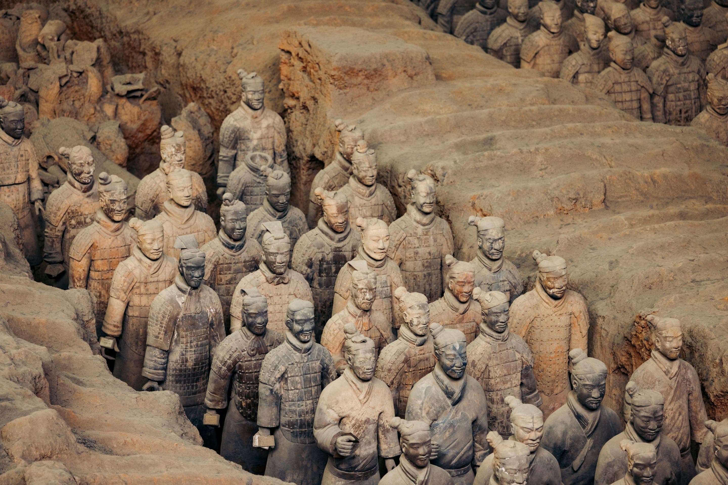Ranks of the Terracotta Army standing in clay-excavated pits at the Qin Shi Huang Mausoleum Site Museum, Xi'an