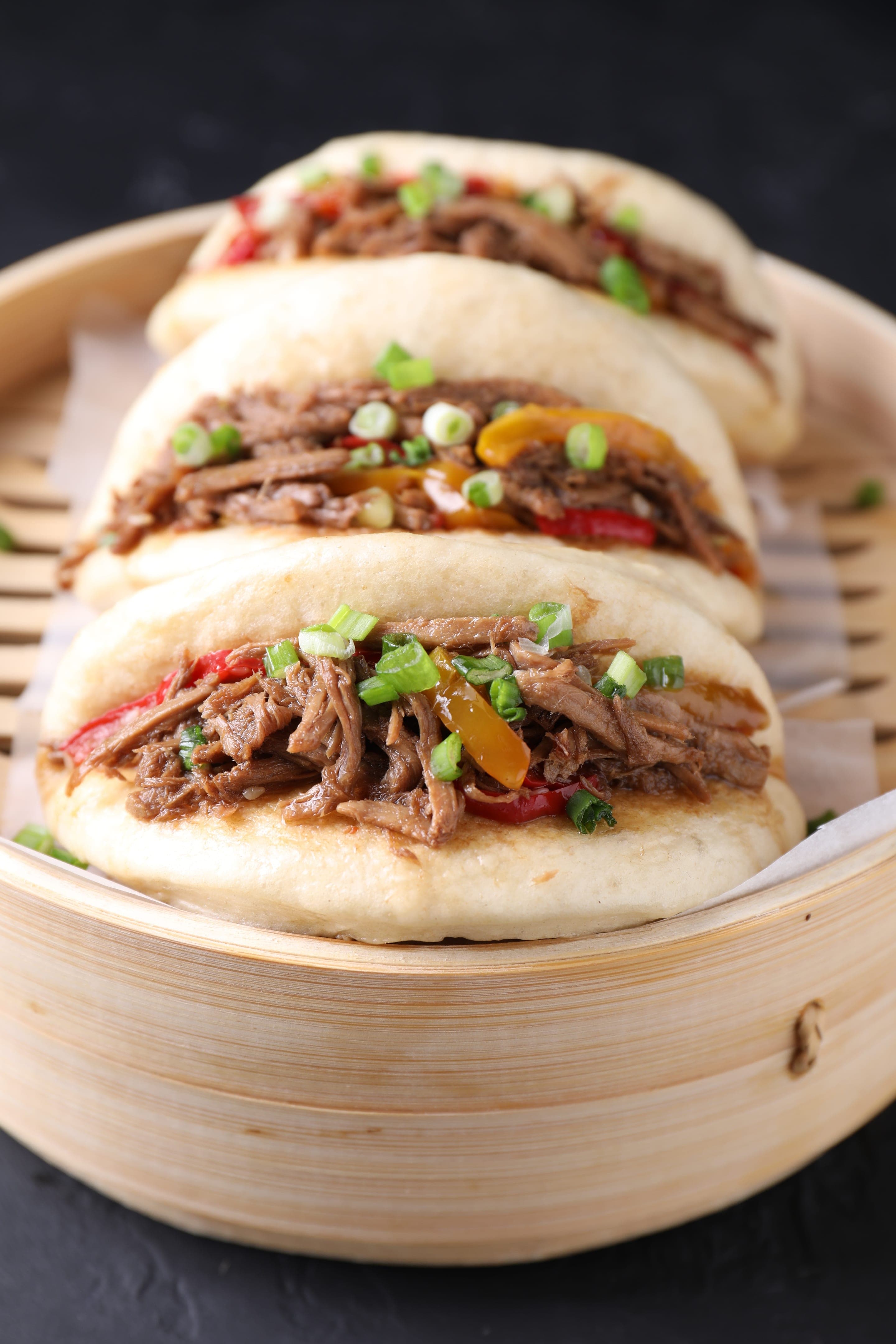 A Xi'an rou jia mo, shredded meat tucked into a wheat bun and served one-handed