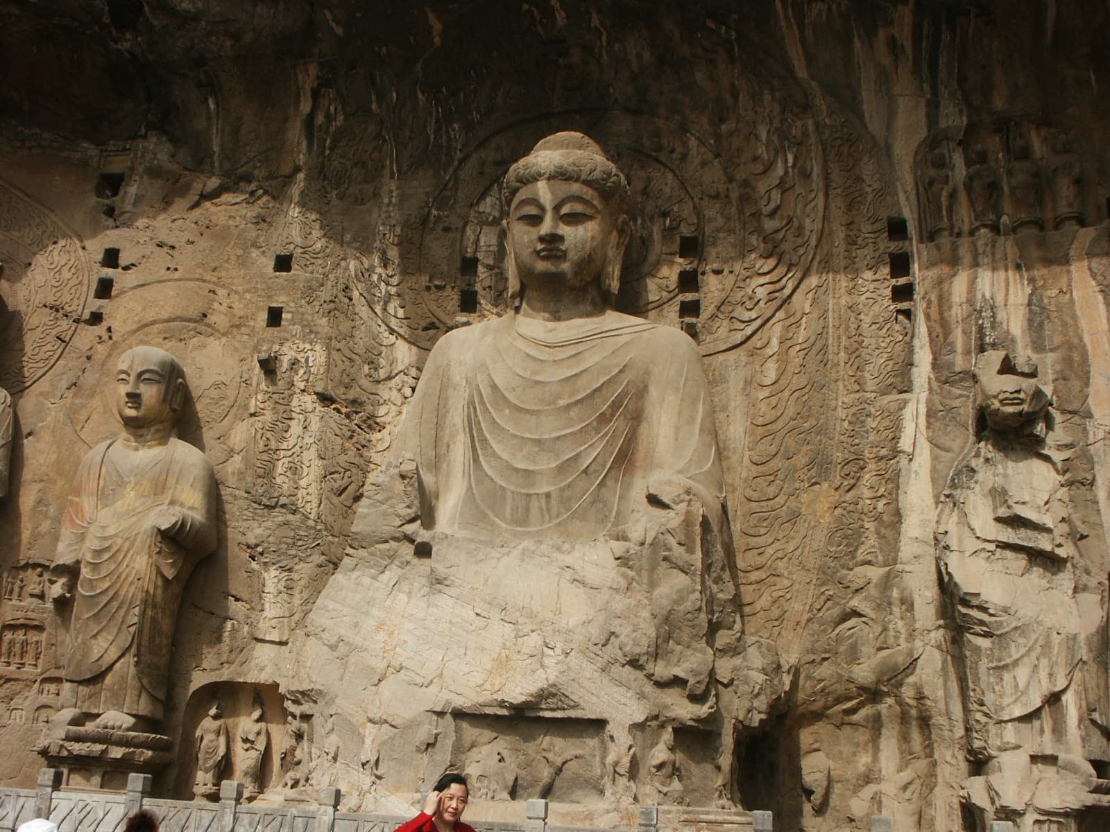 The 17.14-metre Vairocana Buddha at Fengxian Temple, central figure of the Longmen Grottoes cliff face on the Yi River, Luoyang