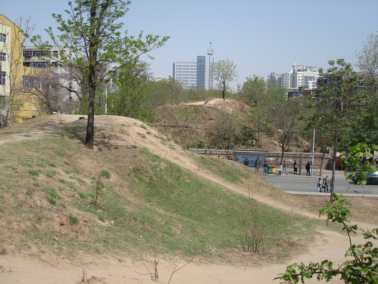 A surviving rammed-earth stretch of the 3,600-year-old Shang dynasty city wall running through central Zhengzhou